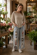 Billie linen top on the model with distressed jeans in a rustic botanical setting